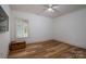 Bright bedroom featuring a chest, luxury vinyl plank flooring and a window at 1012 W Carroll St, Cherryville, NC 28021