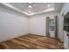 Bright bedroom with hardwood floors, ceiling fan, neutral paint, and large windows for natural light at 1012 W Carroll St, Cherryville, NC 28021