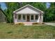 Charming single-story home with a welcoming front porch and beautifully landscaped yard, offering great curb appeal at 1012 W Carroll St, Cherryville, NC 28021
