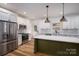 Modern kitchen showcasing an island, stainless steel appliances, ample storage, and stylish finishes at 1012 W Carroll St, Cherryville, NC 28021