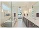 Elegant bathroom with double vanity, walk-in shower, and soaking tub; modern fixtures and tasteful decor at 106 Thunder Hill Rd, Mooresville, NC 28117