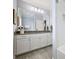 Light and airy bathroom featuring white cabinets, granite countertops, and tiled floors at 106 Thunder Hill Rd, Mooresville, NC 28117