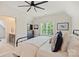 Bright bedroom with a comfortable bed, contemporary ceiling fan, and an en-suite bathroom offering convenience and privacy at 106 Thunder Hill Rd, Mooresville, NC 28117