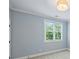 Cozy bedroom with a calming color palette, light-filled window and soft carpet at 106 Thunder Hill Rd, Mooresville, NC 28117