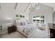 A primary bedroom boasting vaulted ceilings, plush carpeting, and pool views from multiple windows at 106 Thunder Hill Rd, Mooresville, NC 28117