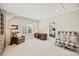 Spacious bonus room with a comfortable seating area, home office setup, and natural lighting for versatile living space at 106 Thunder Hill Rd, Mooresville, NC 28117