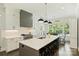 Stylish kitchen with a large island, white cabinetry, pendant lighting, and stainless steel appliances at 106 Thunder Hill Rd, Mooresville, NC 28117