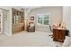Comfortable home office featuring a wooden bookcase, desk, chair, and natural lighting for a productive workspace at 106 Thunder Hill Rd, Mooresville, NC 28117
