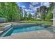 Beautiful backyard with a large in-ground pool, spa, and spacious lawn for outdoor enjoyment at 106 Thunder Hill Rd, Mooresville, NC 28117
