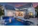 A luxurious pool and spa with patio area offers relaxation and entertainment in this home's backyard at 106 Thunder Hill Rd, Mooresville, NC 28117