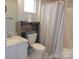 Cozy bathroom with a vanity, toilet, and shower/tub combo with modern fixtures at 109 Gatwick Ct, Statesville, NC 28677