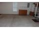 Spacious garage with concrete flooring, natural lighting, and storage cabinets at 109 Gatwick Ct, Statesville, NC 28677