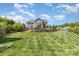 A meticulously maintained backyard with lush green grass and landscaping, perfect for outdoor enjoyment at 1098 Matchstick Sw Pl, Concord, NC 28025