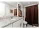 Bathroom with a granite countertop vanity, toilet, and shower with a curtain at 1098 Matchstick Sw Pl, Concord, NC 28025
