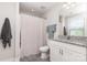 Bathroom featuring a granite countertop, vanity, toilet, and a shower with a neutral shower curtain at 1098 Matchstick Sw Pl, Concord, NC 28025