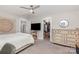 Bedroom features natural light, a cozy bed, and ample storage with a dresser and closet at 1098 Matchstick Sw Pl, Concord, NC 28025