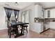 Bright dining area featuring hardwood floors, a modern table, and sliding glass doors for plenty of natural light at 1098 Matchstick Sw Pl, Concord, NC 28025