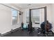 Home gym with weight training equipment and open windows for natural light at 1098 Matchstick Sw Pl, Concord, NC 28025