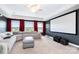 Home theater with a large screen, projector, comfortable seating, and dark walls for an immersive experience at 1098 Matchstick Sw Pl, Concord, NC 28025