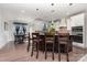 Elegant kitchen with center island, bar stool seating, modern pendant lights, and stainless appliances at 1098 Matchstick Sw Pl, Concord, NC 28025