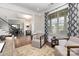 Stylish office with window, comfortable seating and view to entry and dining area at 1098 Matchstick Sw Pl, Concord, NC 28025