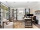 Bright home office with neutral tones, patterned curtains, and ample natural light at 1098 Matchstick Sw Pl, Concord, NC 28025