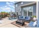 Outdoor patio featuring comfortable seating, a dining area, and lush landscaping at 1098 Matchstick Sw Pl, Concord, NC 28025