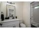This bathroom features white cabinets, modern fixtures, and a shower/tub combo at 115 Woodward Way, Iron Station, NC 28080