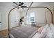 This bedroom features a brass canopy bed, a sitting bench, and a large window at 115 Woodward Way, Iron Station, NC 28080