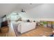 Spacious bonus room with vaulted ceilings, ceiling fans, wood floors and ample space for play and relaxation at 115 Woodward Way, Iron Station, NC 28080