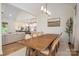 Dining area with an open view to kitchen and living space, perfect for entertaining guests at 115 Woodward Way, Iron Station, NC 28080