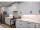 Updated kitchen with stainless steel appliances, quartz countertops, and ample cabinet space at 115 Woodward Way, Iron Station, NC 28080