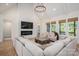 Comfortable living room with fireplace, large windows, and hardwood floors at 115 Woodward Way, Iron Station, NC 28080