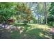 Expansive backyard with mature trees, offering a private outdoor space at 1324 Princeton Ave, Gastonia, NC 28054