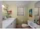 Bathroom with Laundry area, featuring a window and good lighting at 1324 Princeton Ave, Gastonia, NC 28054