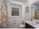 Bright bathroom with a window above the toilet and a patterned shower curtain at 1324 Princeton Ave, Gastonia, NC 28054