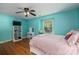 Bright bedroom with light-blue walls, hardwood floors, and window seat at 1324 Princeton Ave, Gastonia, NC 28054