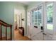 Inviting entryway with natural light, hardwood floors, and a view into the living room at 1324 Princeton Ave, Gastonia, NC 28054