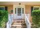 Up-close front door view with brick steps and white handrails at 1324 Princeton Ave, Gastonia, NC 28054