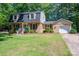Lovely brick home with a black roof, garage, and tidy, green lawn at 1324 Princeton Ave, Gastonia, NC 28054