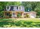 Charming brick home featuring a manicured lawn and beautiful landscaping at 1324 Princeton Ave, Gastonia, NC 28054