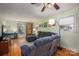 Spacious living room with hardwood floors, bookcase, and bright natural light at 1324 Princeton Ave, Gastonia, NC 28054