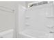 Clean bathroom featuring a built-in shower and tub with handy storage shelves at 13332 Caite Ridge Rd, Davidson, NC 28036