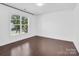 Neutral bedroom with a large window bringing in lots of natural light at 13332 Caite Ridge Rd, Davidson, NC 28036