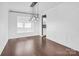 Bright dining room with rich hardwood floors and modern pendant lighting at 13332 Caite Ridge Rd, Davidson, NC 28036