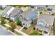 New two-story home showcases a covered porch with stone accents, manicured lawn, and charming curb appeal at 13332 Caite Ridge Rd, Davidson, NC 28036