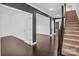 Open-concept foyer featuring hardwood floors and a view into the living areas and stairway at 13332 Caite Ridge Rd, Davidson, NC 28036
