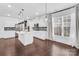 Spacious kitchen with center island, stainless steel appliances, hardwood floors, and plenty of natural light at 13332 Caite Ridge Rd, Davidson, NC 28036