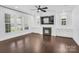 Living Room with lots of natural light, built in bookcases, fire place, and ceiling fan at 13332 Caite Ridge Rd, Davidson, NC 28036