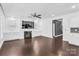Living Room featuring a fireplace, hardwood floors, and a ceiling fan at 13332 Caite Ridge Rd, Davidson, NC 28036